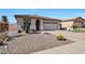 Inviting home with desert landscaping, including cacti and decorative rocks at 10786 W Chisholm Dr, Sun City, AZ 85373