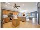 Spacious kitchen flows seamlessly into the living room, offering stainless steel appliances and abundant natural light at 10786 W Chisholm Dr, Sun City, AZ 85373