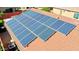 A red tile roof is covered by several solar panels at 10786 W Chisholm Dr, Sun City, AZ 85373