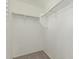 Walk-in closet with shelving and carpet at 10827 W Bronco Trl, Peoria, AZ 85383