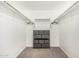 Walk-in closet with shelving and gray storage cubes at 10827 W Bronco Trl, Peoria, AZ 85383