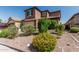 Two-story home featuring a tile roof, attached garage and desert landscaping at 10827 W Bronco Trl, Peoria, AZ 85383