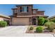 Two-story home featuring a tile roof, attached garage and desert landscaping at 10827 W Bronco Trl, Peoria, AZ 85383