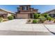 Two-story home featuring a tile roof, large garage and desert landscaping at 10827 W Bronco Trl, Peoria, AZ 85383