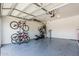Well-organized garage with bikes, exercise equipment, and storage solutions at 10827 W Bronco Trl, Peoria, AZ 85383
