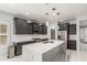 Gourmet kitchen featuring stainless appliances and marble countertops at 10827 W Bronco Trl, Peoria, AZ 85383