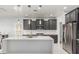 Gourmet kitchen featuring stainless appliances and marble countertops at 10827 W Bronco Trl, Peoria, AZ 85383