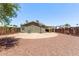 Open backyard has a basketball court and a low-maintenance desert landscape at 10951 N 91St Ave # 84, Peoria, AZ 85345