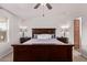 Comfortable primary bedroom with ceiling fan and lamps on nightstands at 10951 N 91St Ave # 84, Peoria, AZ 85345