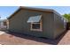 View of the exterior with awning-shaded windows and low-maintenance rock landscaping at 10951 N 91St Ave # 84, Peoria, AZ 85345
