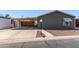 Charming home featuring a covered carport and low-maintenance landscaping at 10951 N 91St Ave # 84, Peoria, AZ 85345