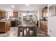 Eat-in kitchen features wood cabinets, a large island, and modern appliances at 10951 N 91St Ave # 84, Peoria, AZ 85345