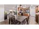 Well-lit kitchen featuring a center island, wood cabinetry and stainless steel refrigerator at 10951 N 91St Ave # 84, Peoria, AZ 85345