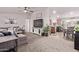 Open-concept living room seamlessly connects to the kitchen and dining area at 10951 N 91St Ave # 84, Peoria, AZ 85345