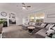 Cozy living room with a comfortable sectional sofa and bright natural light at 10951 N 91St Ave # 84, Peoria, AZ 85345