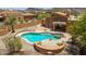 Aerial view of desert home showcasing a pool, jacuzzi, and patio at 11238 N 11Th St, Phoenix, AZ 85020