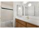 Bathroom showcasing a tub, oak vanity, and modern lighting at 11238 N 11Th St, Phoenix, AZ 85020