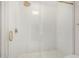 Modern bathroom featuring glass shower with gold accents and a rain shower head at 11238 N 11Th St, Phoenix, AZ 85020