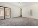 Bedroom featuring access to the back patio, neutral carpet, and recessed lighting at 11238 N 11Th St, Phoenix, AZ 85020