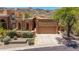 Charming home with well-manicured landscaping, mature trees, and a two-car garage at 11238 N 11Th St, Phoenix, AZ 85020