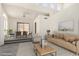 Cozy living room offers ample natural light, stylish furnishings, and a tranquil atmosphere at 11238 N 11Th St, Phoenix, AZ 85020