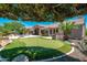 Spacious backyard with putting green, built in grill and desert landscaping at 12120 E Cortez Dr, Scottsdale, AZ 85259