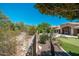 Expansive backyard featuring putting green and pool, surrounded by lush greenery at 12120 E Cortez Dr, Scottsdale, AZ 85259