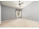 Bedroom with grey walls, a vaulted ceiling, and a ceiling fan at 12120 E Cortez Dr, Scottsdale, AZ 85259