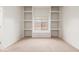 Bedroom with white walls and built in shelving units around the window at 12120 E Cortez Dr, Scottsdale, AZ 85259