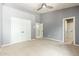 Bedroom with grey walls, white trim, and multiple doors at 12120 E Cortez Dr, Scottsdale, AZ 85259