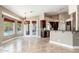 Breakfast room with pool views, open to the kitchen with stainless steel appliances at 12120 E Cortez Dr, Scottsdale, AZ 85259