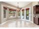 Inviting breakfast room with a view of the backyard pool and patio area at 12120 E Cortez Dr, Scottsdale, AZ 85259