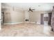 Large living room featuring a fireplace, ceiling fan, tile floors, and neutral wall color at 12120 E Cortez Dr, Scottsdale, AZ 85259