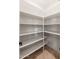 Walk-in pantry with ample storage space and shelving for organized storage at 12120 E Cortez Dr, Scottsdale, AZ 85259