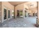 Covered outdoor patio with access to the yard and beautiful desert view at 12120 E Cortez Dr, Scottsdale, AZ 85259