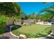 Landscaped backyard with putting green, desert plants and shrubbery at 12120 E Cortez Dr, Scottsdale, AZ 85259