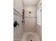 Beautiful tiled shower with a built in seat and dark hardware at 12120 E Cortez Dr, Scottsdale, AZ 85259