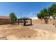 Spacious backyard features a gazebo with mature shade trees, providing privacy at 12228 N 122Nd Dr, El Mirage, AZ 85335