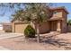 Lovely two-story home with terracotta roof, attached garage, and low-maintenance desert landscaping at 12228 N 122Nd Dr, El Mirage, AZ 85335