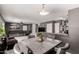Open concept living space with gray walls, wood-look floors, featuring dining room and a living room at 12228 N 122Nd Dr, El Mirage, AZ 85335