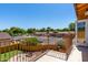 Balcony view showcasing street view, greenery, and neighborhood houses under a clear sky at 12459 N 36Th St, Phoenix, AZ 85032