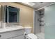 Bathroom features a granite countertop, sink, mirror, toilet, and shower with sliding glass door at 12459 N 36Th St, Phoenix, AZ 85032