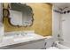 Bathroom with ornate mirror, granite counters, decorative walls, and shower with purple accents at 12459 N 36Th St, Phoenix, AZ 85032