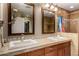 Bathroom featuring double sinks, tiled countertops, and a separate shower for added convenience at 12459 N 36Th St, Phoenix, AZ 85032