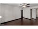 Bedroom features a ceiling fan and provides great natural lighting with dark floors at 12459 N 36Th St, Phoenix, AZ 85032