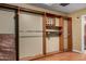 Spacious walk-in closet features custom shelving, providing ample storage and organization solutions at 12459 N 36Th St, Phoenix, AZ 85032