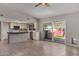 Modern kitchen with white cabinets, black countertops, stainless steel appliances, and tile flooring, perfect for cooking at 12459 N 36Th St, Phoenix, AZ 85032