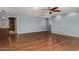 Open living room boasts hardwood floors, modern lighting, and seamless flow to the bathroom at 12459 N 36Th St, Phoenix, AZ 85032