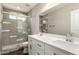 Modern bathroom featuring a double vanity, stylish shower with glass door, and updated fixtures at 1502 E Minton Dr, Tempe, AZ 85282
