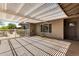 Relaxing covered patio with a modern shade structure, offering an inviting outdoor living space at 1502 E Minton Dr, Tempe, AZ 85282